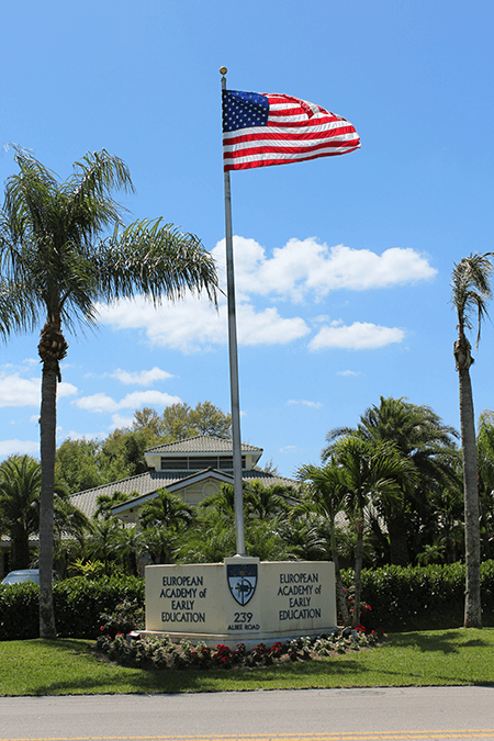 EEAE entrance sign with american flag image